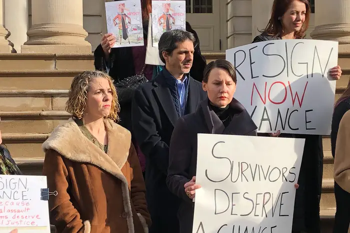 A group of protesters, including two women who said they'd been abused by Robert Hadden, called for Cyrus Vance to step down on the steps of city hall last month.